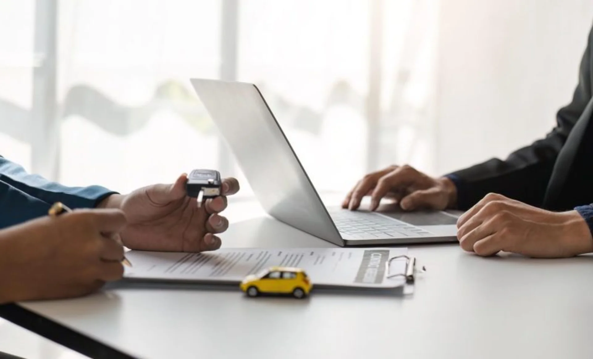 signing-car-insurance-document-or-lease-paper